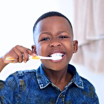 Child brushing teeth