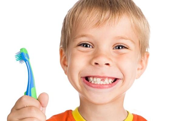 Young boy with missing tooth