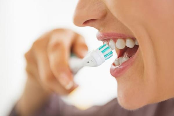 Close-up of woman brushing teeth